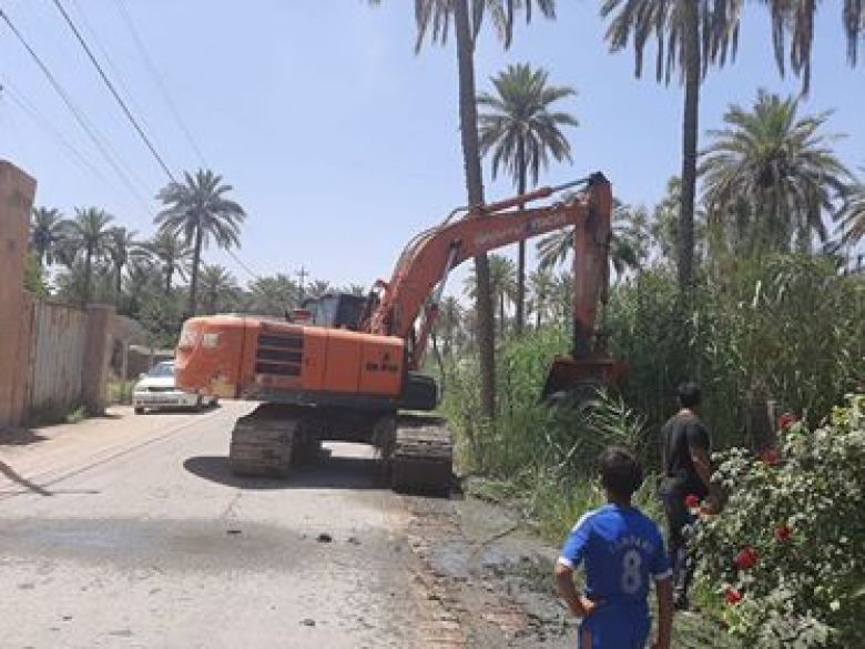 دائرة الموارد المائية وبالتعاون مع جامعة كربلاء تنفذ حملة كري نهر فريحة الواصل للمدينة الجامعية